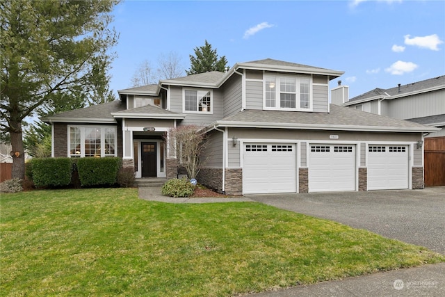 view of front facade featuring a garage and a front yard