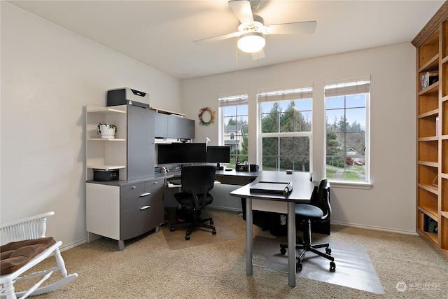 office area featuring light colored carpet and ceiling fan