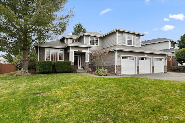 view of front of home featuring a garage and a front yard