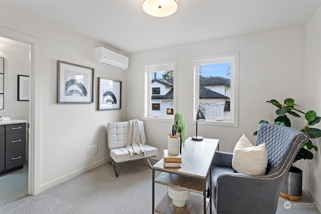 sitting room with an AC wall unit and light colored carpet