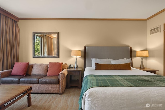 bedroom with ornamental molding