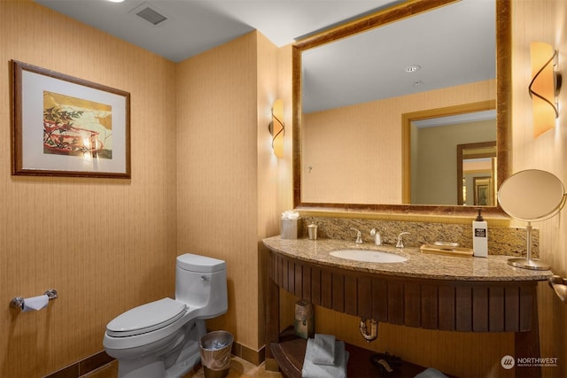 bathroom featuring sink and toilet