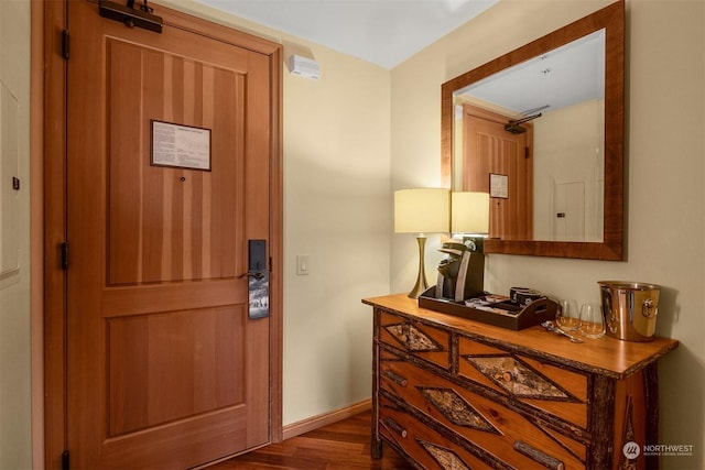 foyer entrance with dark hardwood / wood-style floors