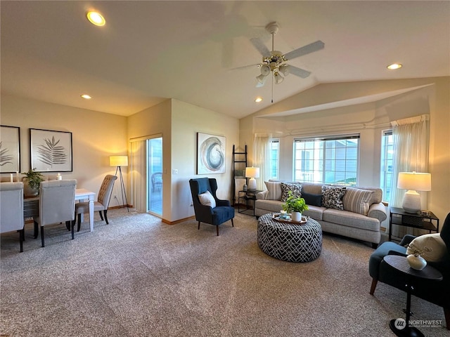 carpeted living room featuring ceiling fan and lofted ceiling