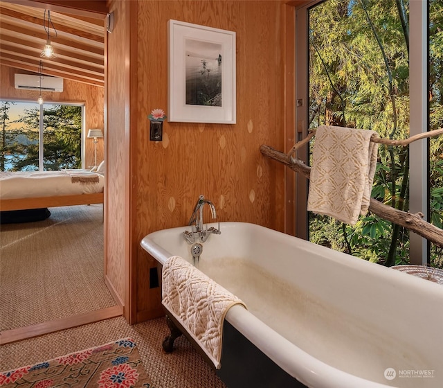 bathroom with vaulted ceiling, a bathtub, and wooden walls