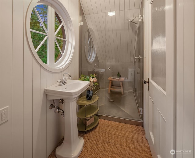 bathroom featuring wooden walls