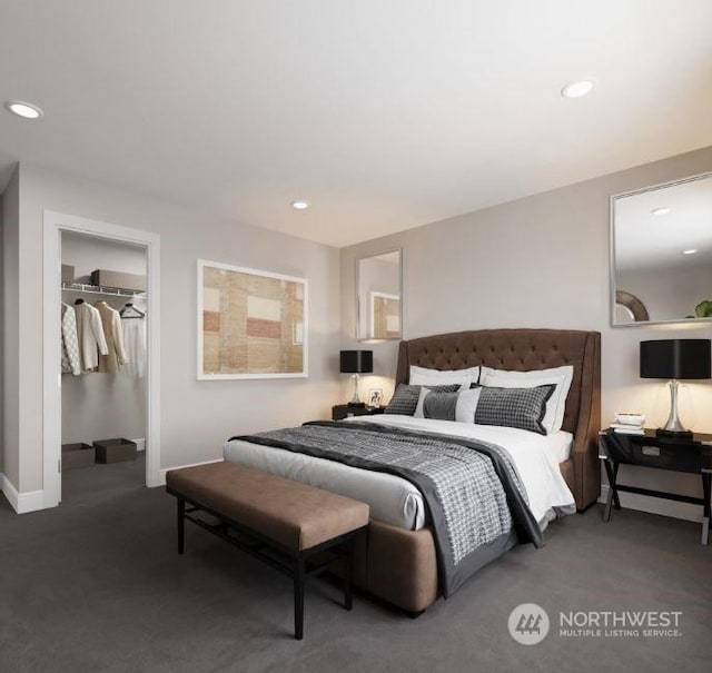 bedroom featuring a walk in closet and a closet