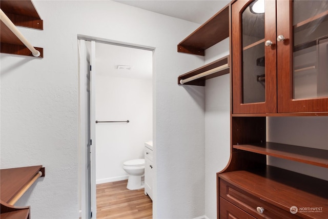 walk in closet featuring light wood-type flooring