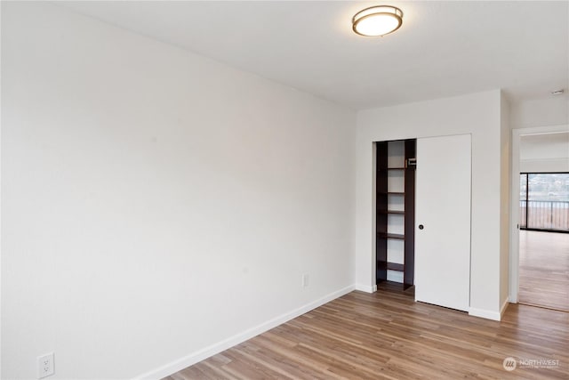 unfurnished room with light hardwood / wood-style floors