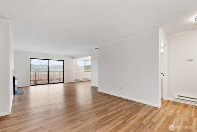 unfurnished living room featuring a baseboard radiator, light wood-type flooring, ornamental molding, and a baseboard heating unit