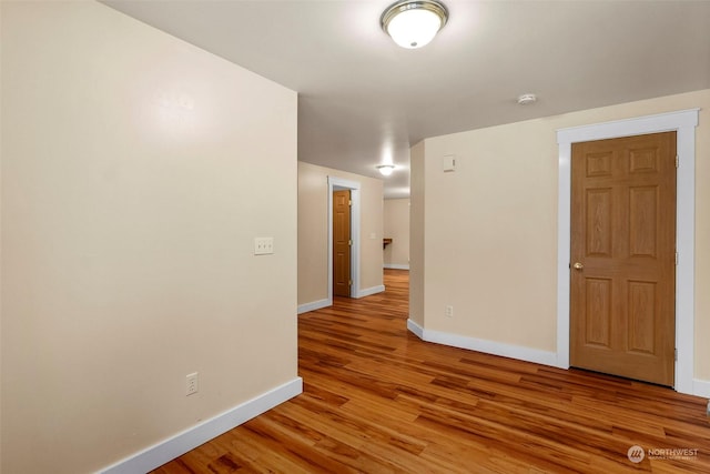 spare room with light hardwood / wood-style flooring