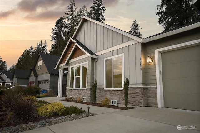 property exterior at dusk with a garage