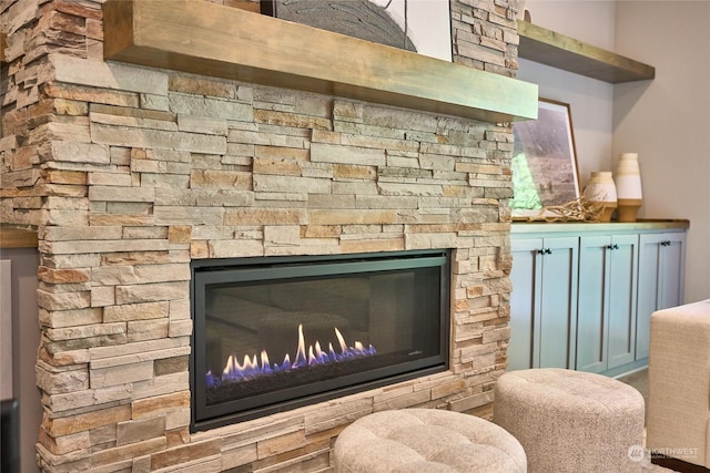 room details featuring a stone fireplace