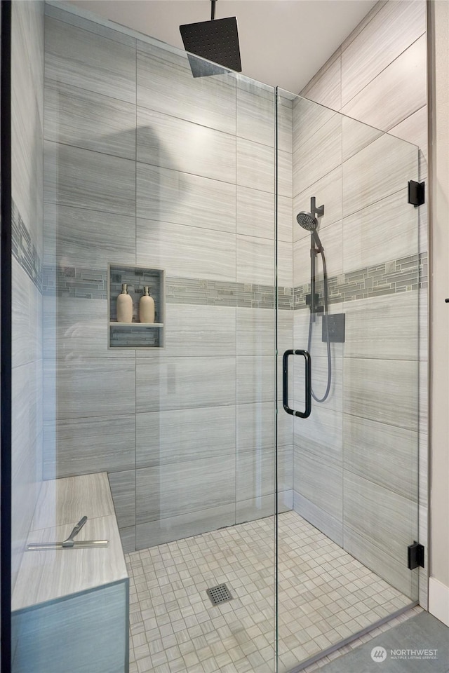 bathroom with a shower with shower door