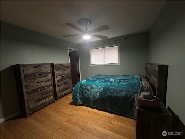 bedroom featuring ceiling fan and light wood-type flooring