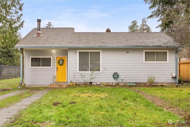 ranch-style house featuring a front lawn