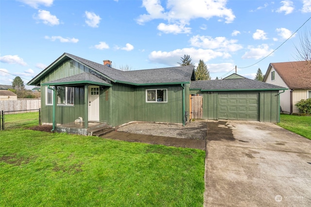 ranch-style home with a garage and a front yard