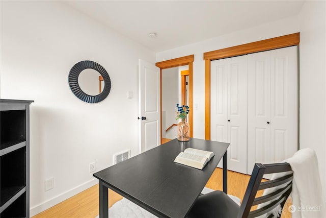 home office with light wood-type flooring