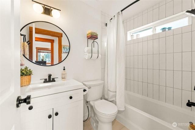 full bathroom featuring shower / tub combo, vanity, and toilet