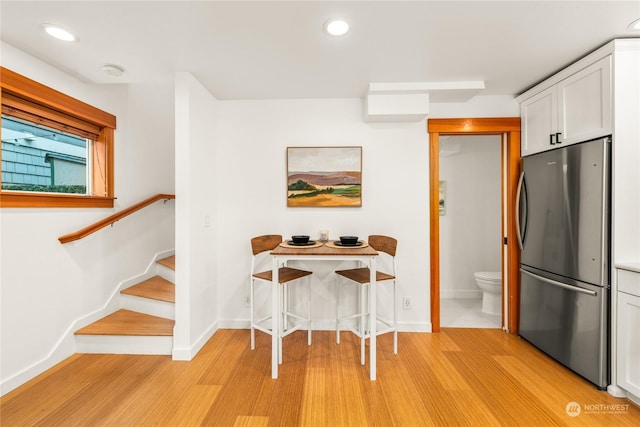 unfurnished dining area with light hardwood / wood-style flooring