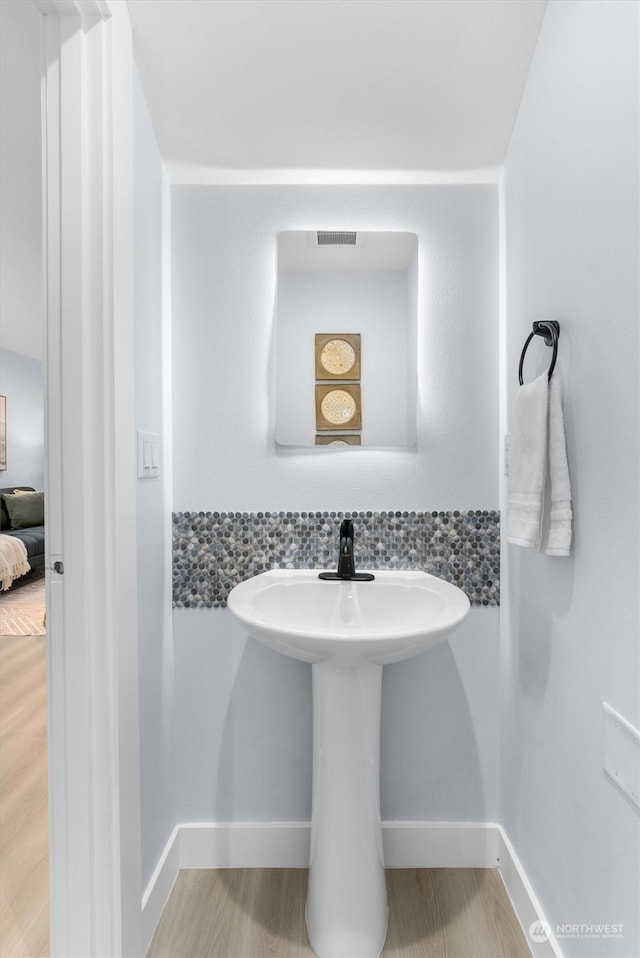 bathroom featuring wood-type flooring