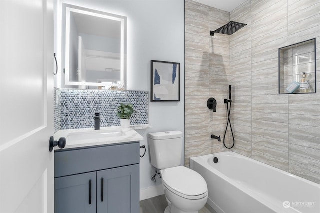 full bathroom featuring tiled shower / bath, hardwood / wood-style floors, toilet, backsplash, and vanity