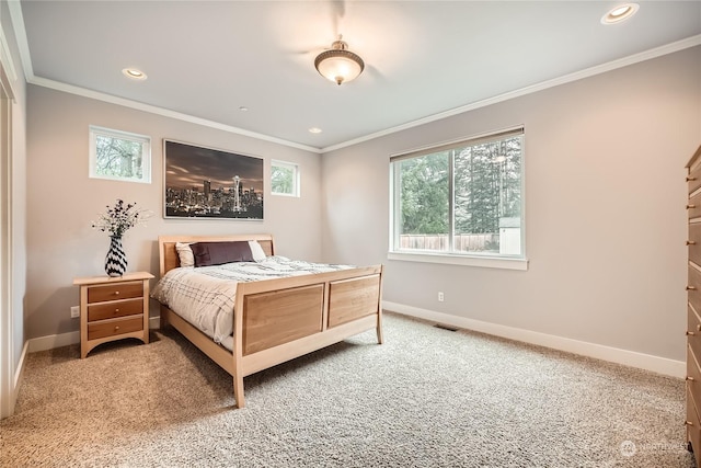 bedroom featuring ornamental molding and carpet flooring