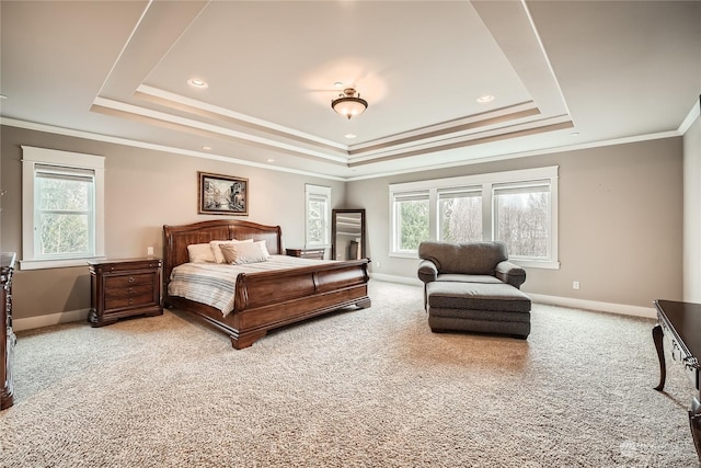 bedroom with light carpet, baseboards, a raised ceiling, and crown molding