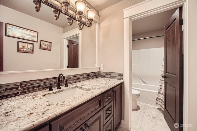 full bathroom featuring vanity, backsplash, shower / bathing tub combination, and toilet