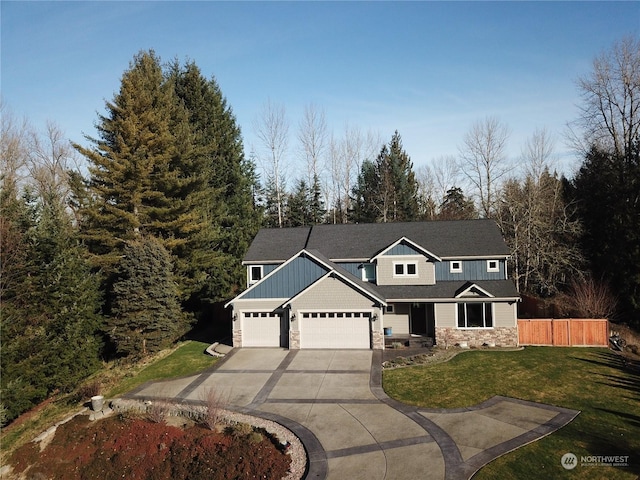 view of front of house featuring a garage and a front yard