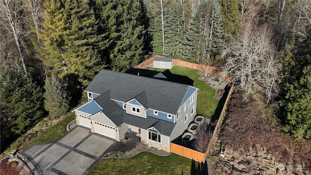 drone / aerial view featuring a view of trees