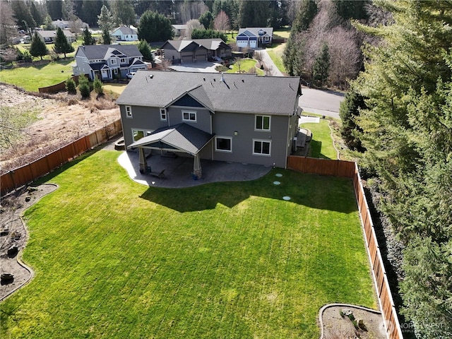 birds eye view of property with a residential view