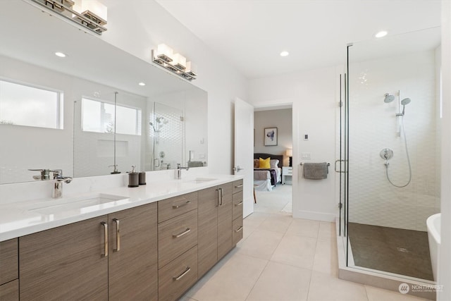 bathroom featuring tile patterned floors, vanity, and an enclosed shower