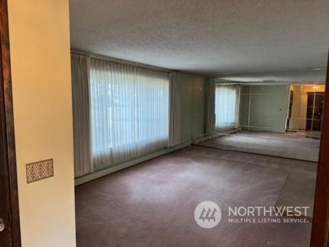 empty room featuring a textured ceiling