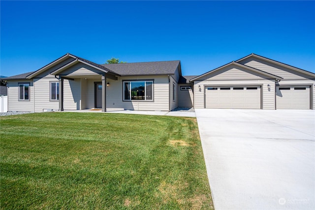 ranch-style home with a front yard and a garage