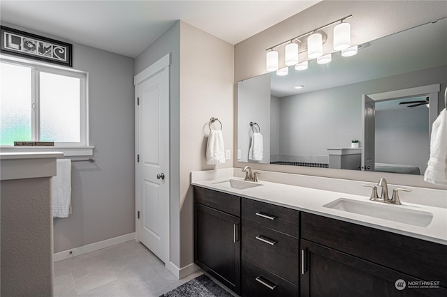 bathroom with vanity and tile patterned flooring