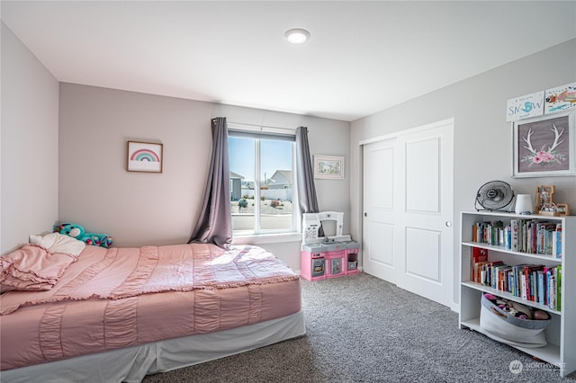 carpeted bedroom with a closet