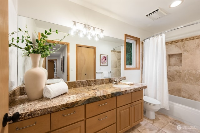 full bathroom with vanity, toilet, and shower / bath combo with shower curtain