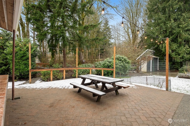 view of patio featuring a storage shed