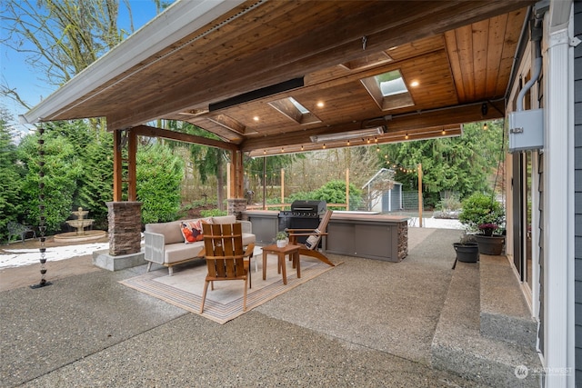 view of patio featuring area for grilling, a storage shed, and an outdoor living space