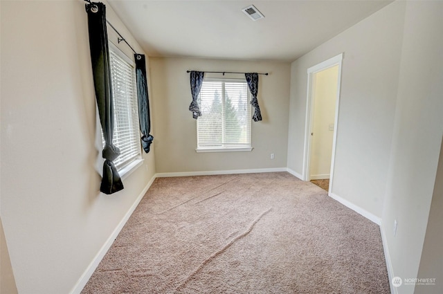 unfurnished bedroom featuring light colored carpet