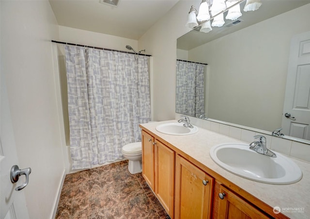 full bathroom with toilet, vanity, a chandelier, and shower / tub combo with curtain