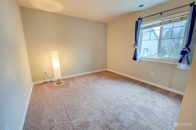 spare room featuring carpet flooring