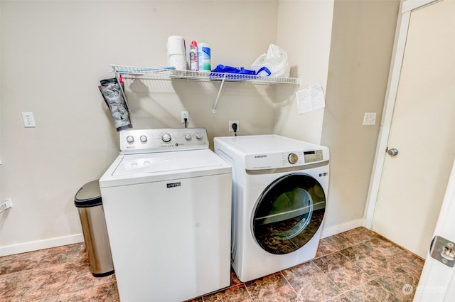 laundry area with washing machine and clothes dryer