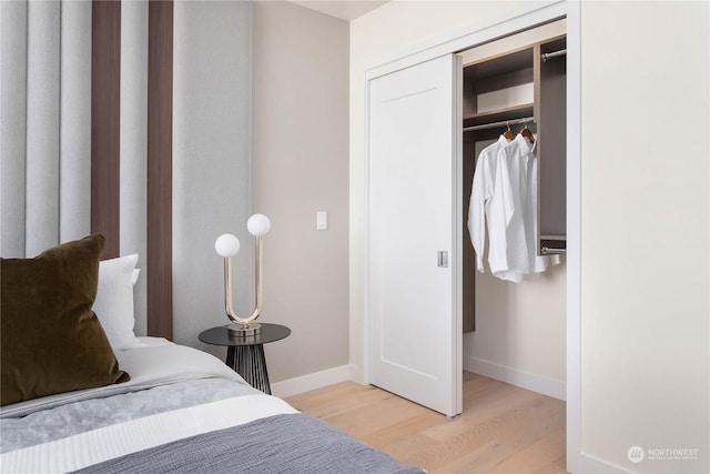 bedroom with a closet and light wood-type flooring