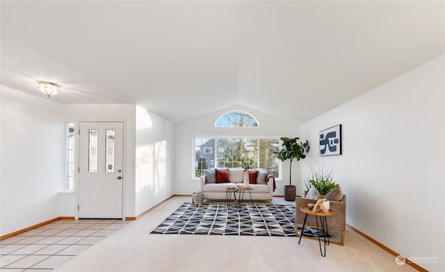 carpeted living room featuring vaulted ceiling and plenty of natural light