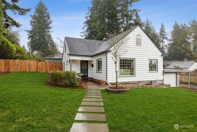 exterior space featuring a garage and a lawn