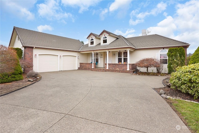 view of front of property with a garage and a porch