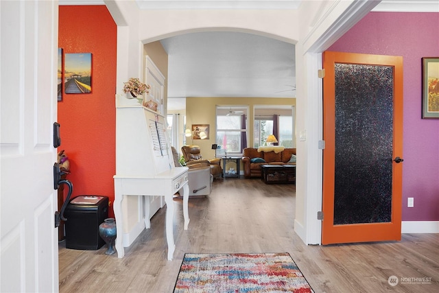 foyer featuring ceiling fan and light hardwood / wood-style floors