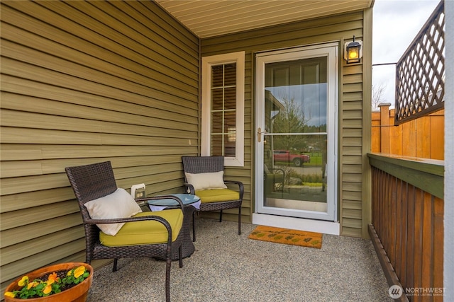 doorway to property featuring a patio and fence